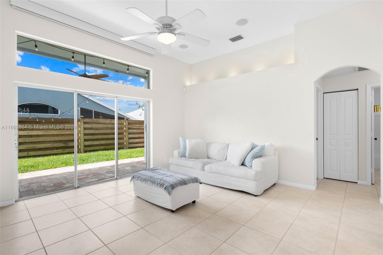 6054 Foster Street Jupiter, FL 33458 - Photo 29 of 50 a living room with furniture and a large window