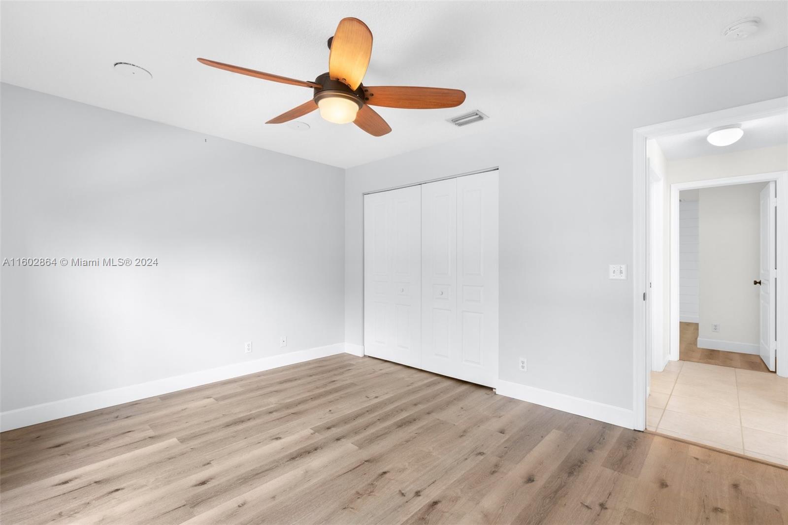 6054 Foster Street Jupiter, FL 33458 - Photo 31 of 50 a view of a room with wooden floor