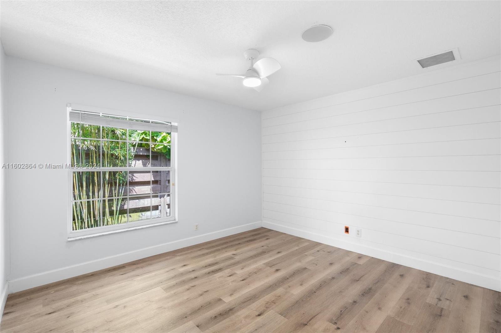 6054 Foster Street Jupiter, FL 33458 - Photo 33 of 50 an empty room with a window