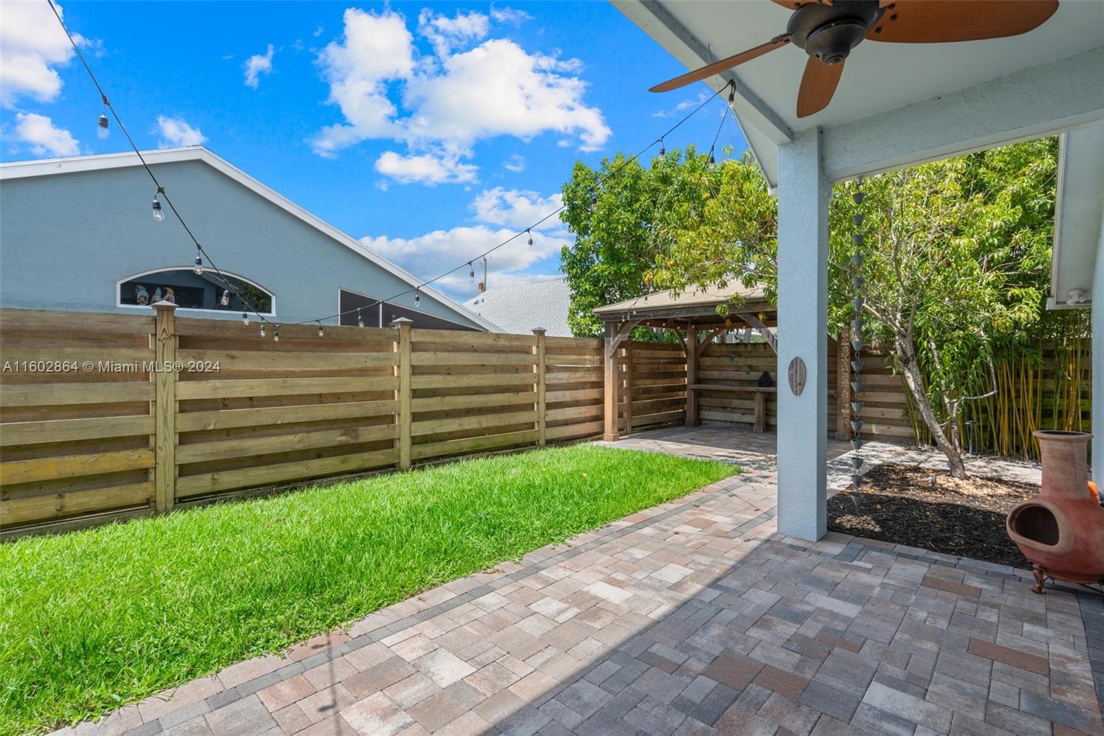 6054 Foster Street Jupiter, FL 33458 - Photo 34 of 50 a view of a backyard with sitting area