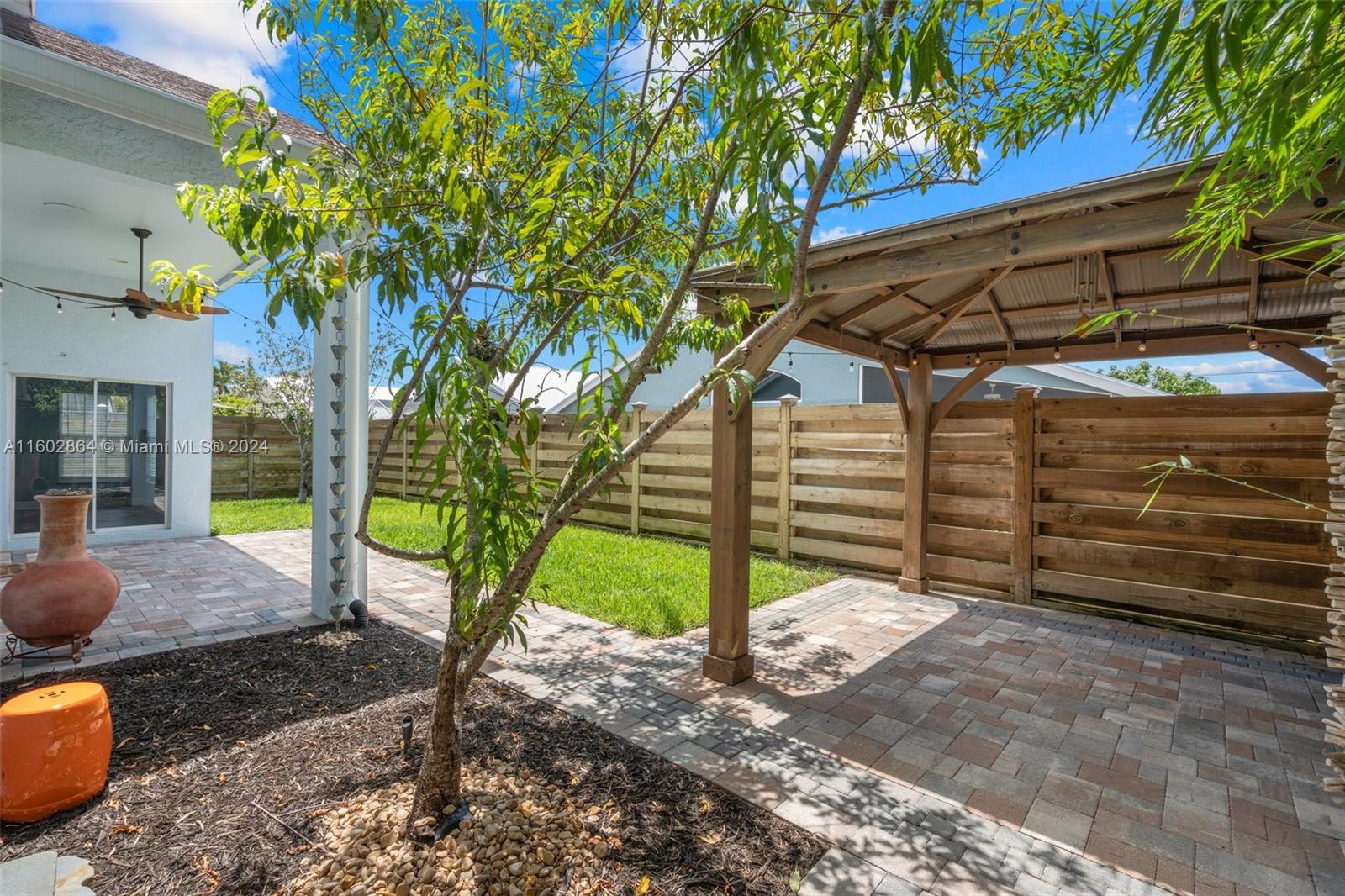 6054 Foster Street Jupiter, FL 33458 - Photo 35 of 50 a view of a backyard with a tree
