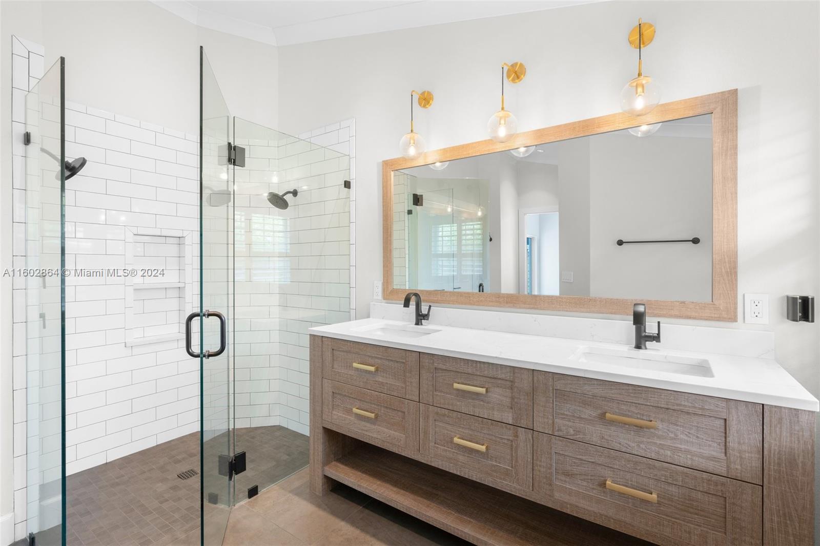 6054 Foster Street Jupiter, FL 33458 - Photo 4 of 50 a bathroom with a double vanity sink mirror and double
