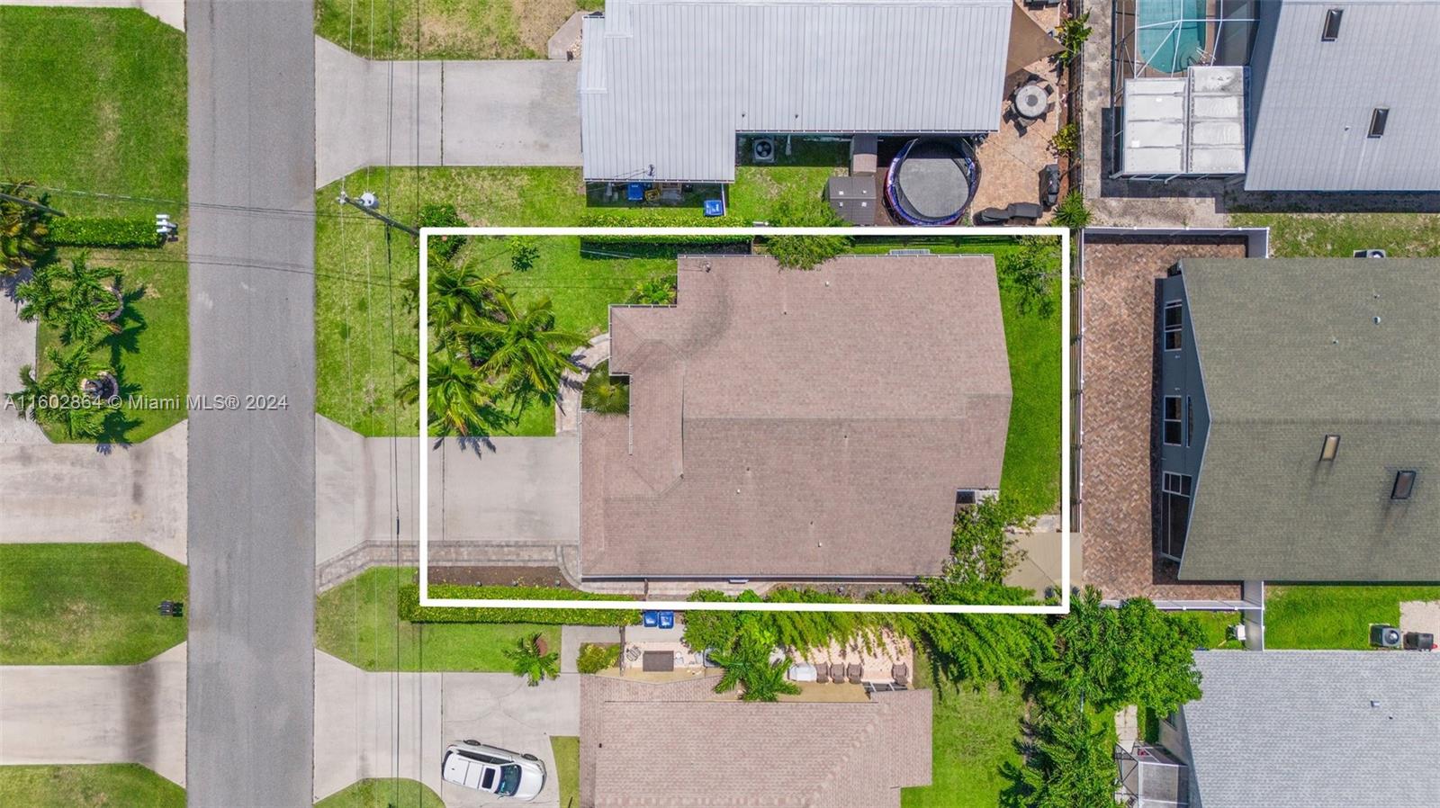 6054 Foster Street Jupiter, FL 33458 - Photo 43 of 50 an aerial view of a house with a garden and a yard