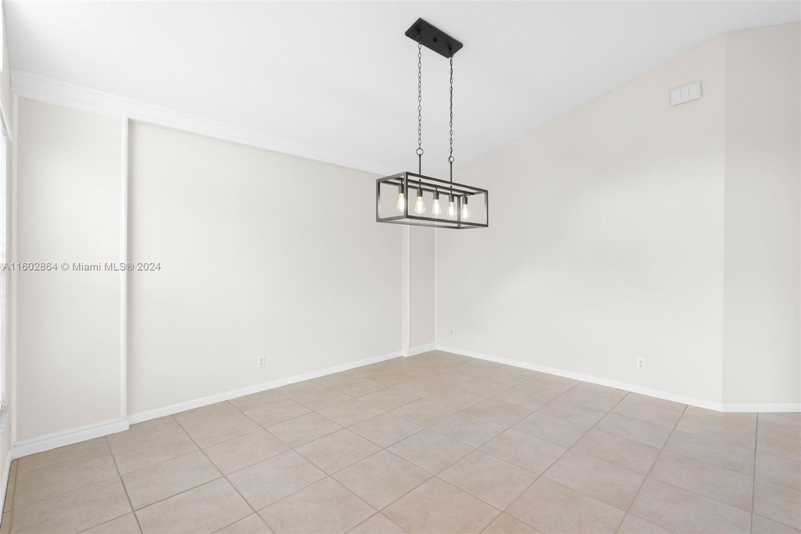 6054 Foster Street Jupiter, FL 33458 - Photo 10 of 50 a view of a room with a wall dryer and a ceiling fan