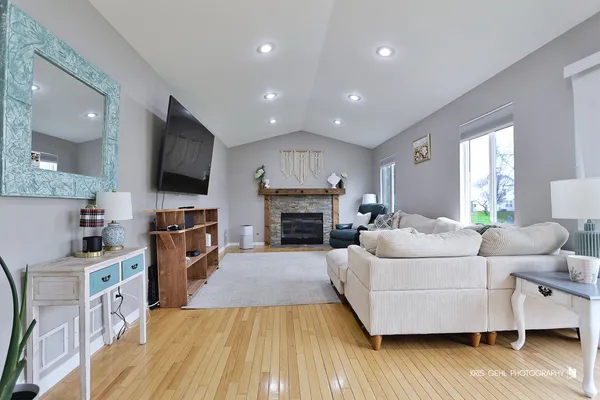 a living room with furniture and a fireplace or television