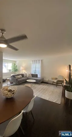 a room with a table chairs and a stove