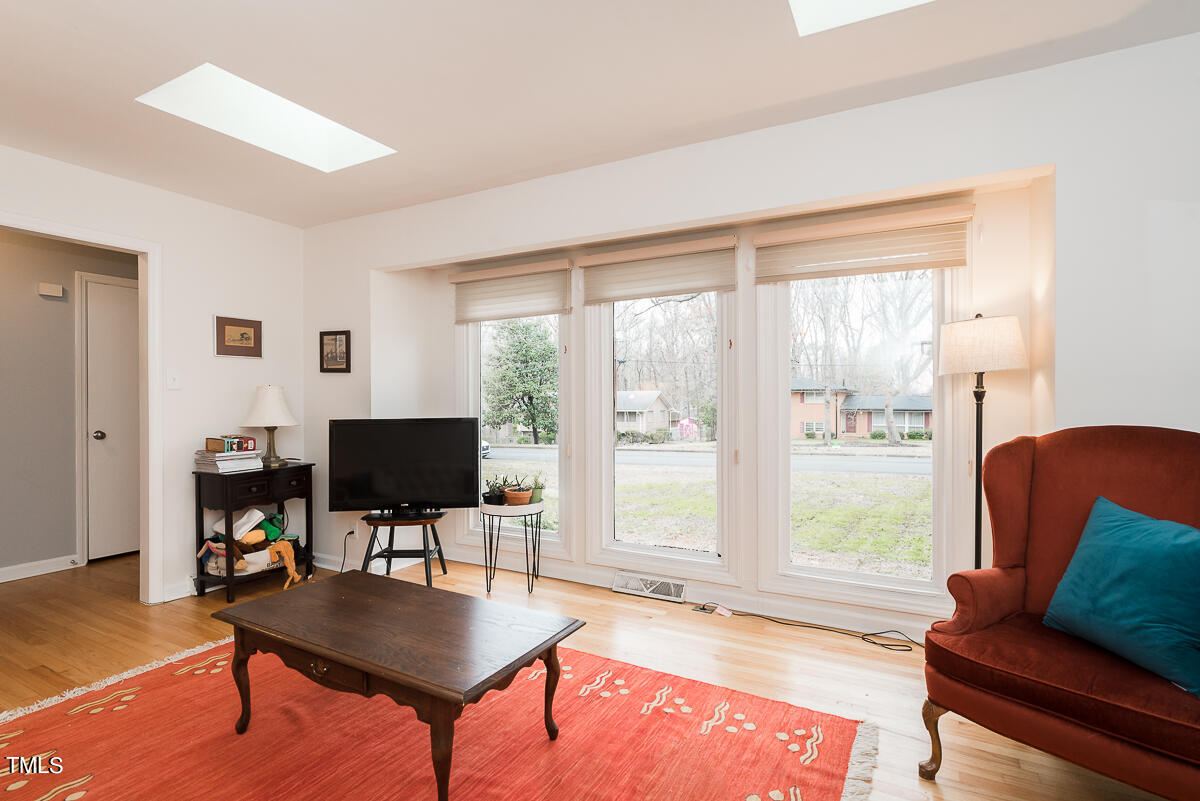1026 Jerome Road Durham, NC 27713 - Photo 11 of 27 a living room with furniture and a flat screen tv