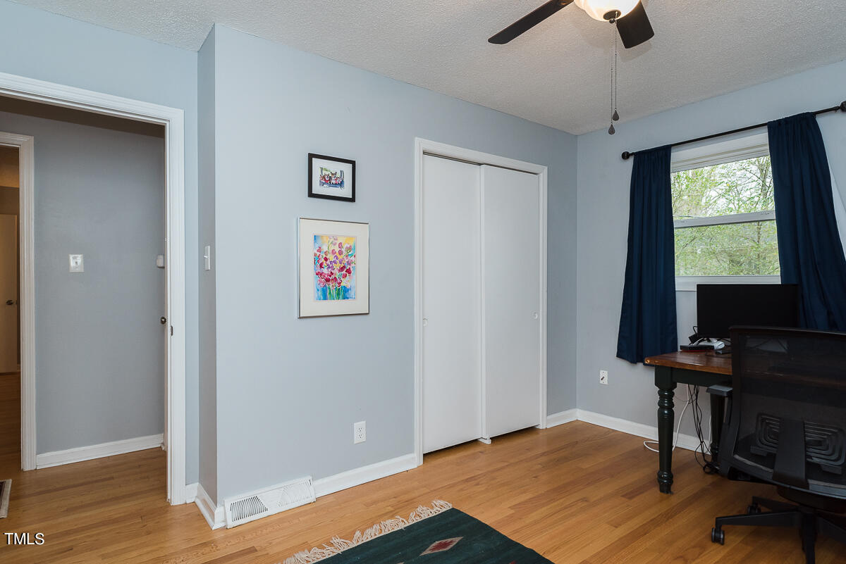 1026 Jerome Road Durham, NC 27713 - Photo 13 of 27 a view of room with hardwood floor and workspace