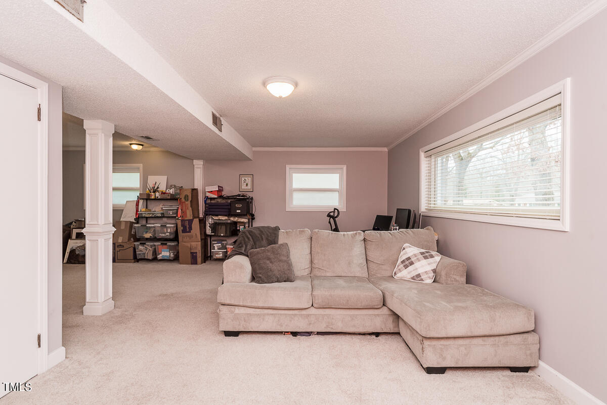 1026 Jerome Road Durham, NC 27713 - Photo 16 of 27 a living room with furniture and a large window