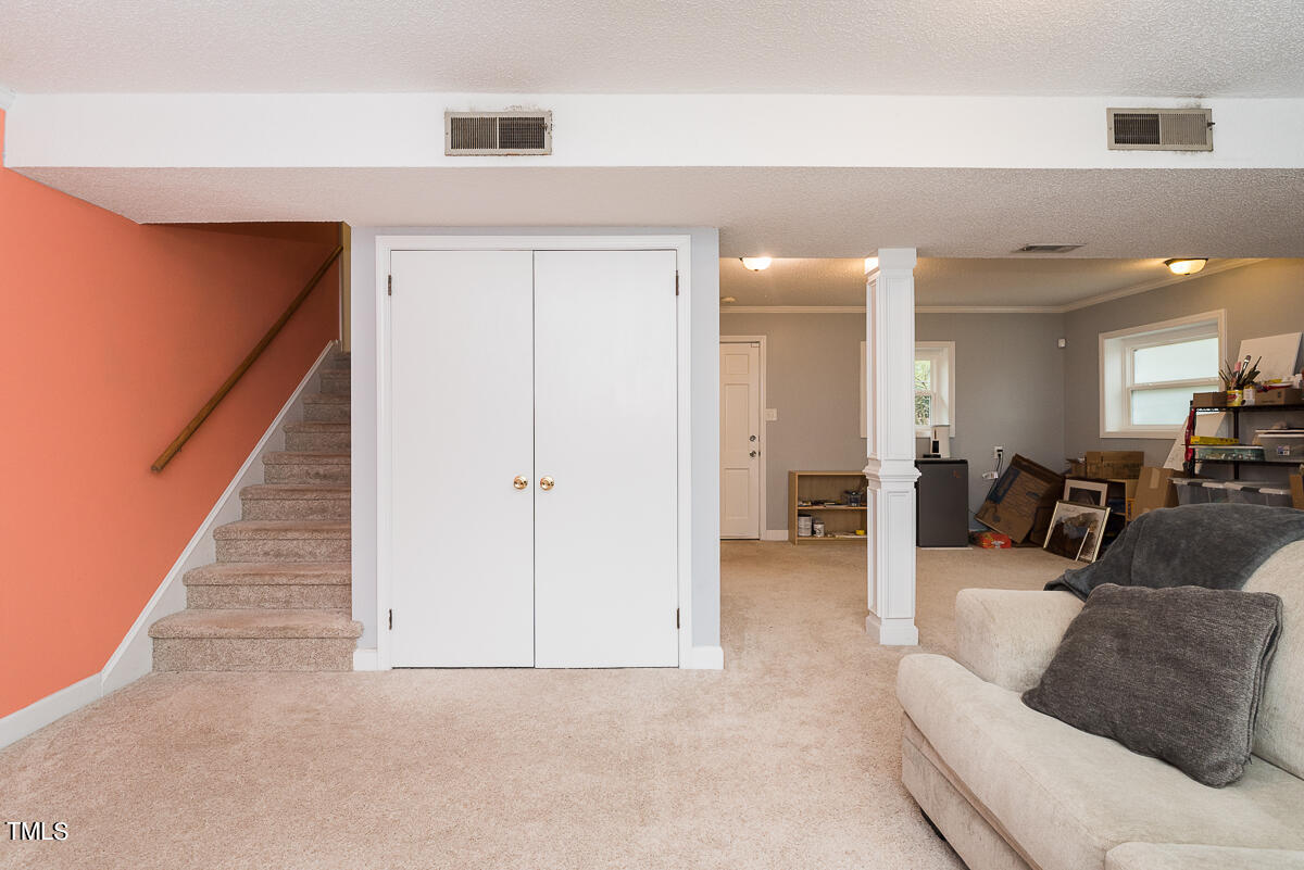 1026 Jerome Road Durham, NC 27713 - Photo 17 of 27 a living room with furniture and a entryway
