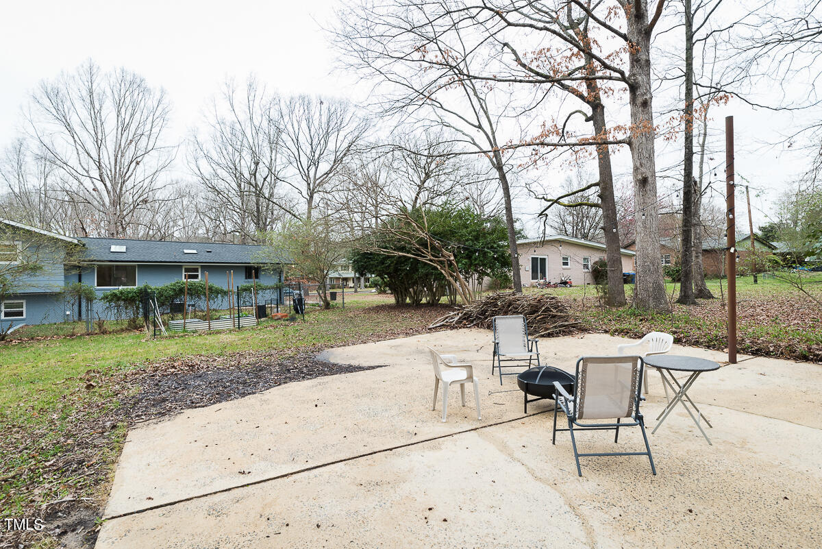 1026 Jerome Road Durham, NC 27713 - Photo 22 of 27 a view of a house with backyard and sitting area