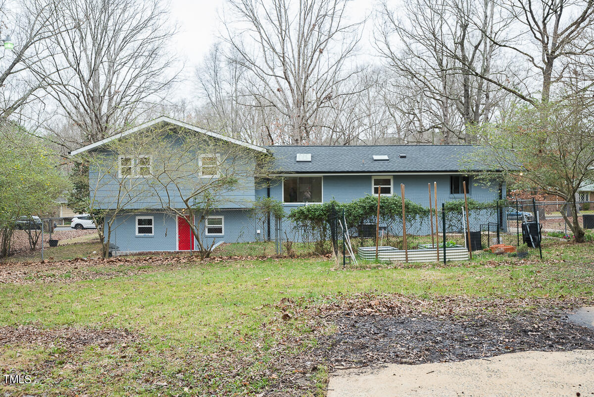 1026 Jerome Road Durham, NC 27713 - Photo 23 of 27 a house that has a tree in front of it