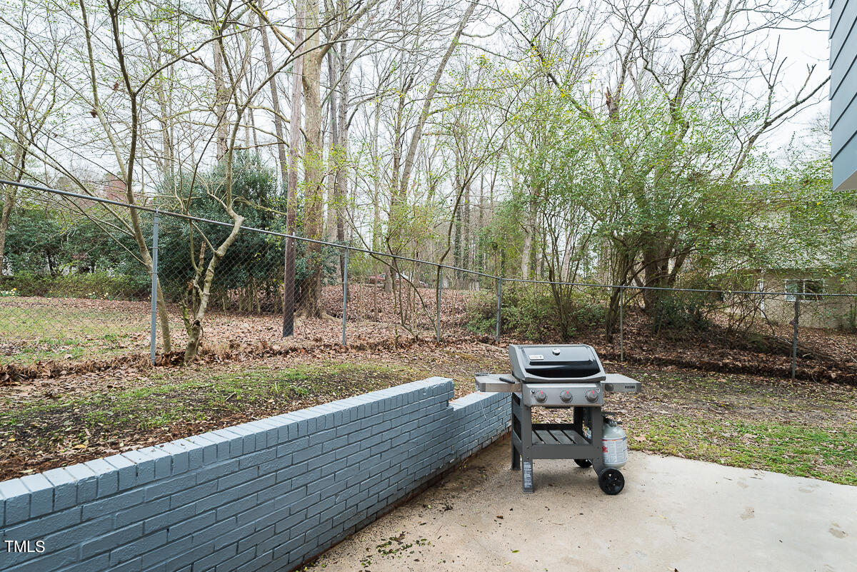 1026 Jerome Road Durham, NC 27713 - Photo 24 of 27 a backyard of a house with table and chairs