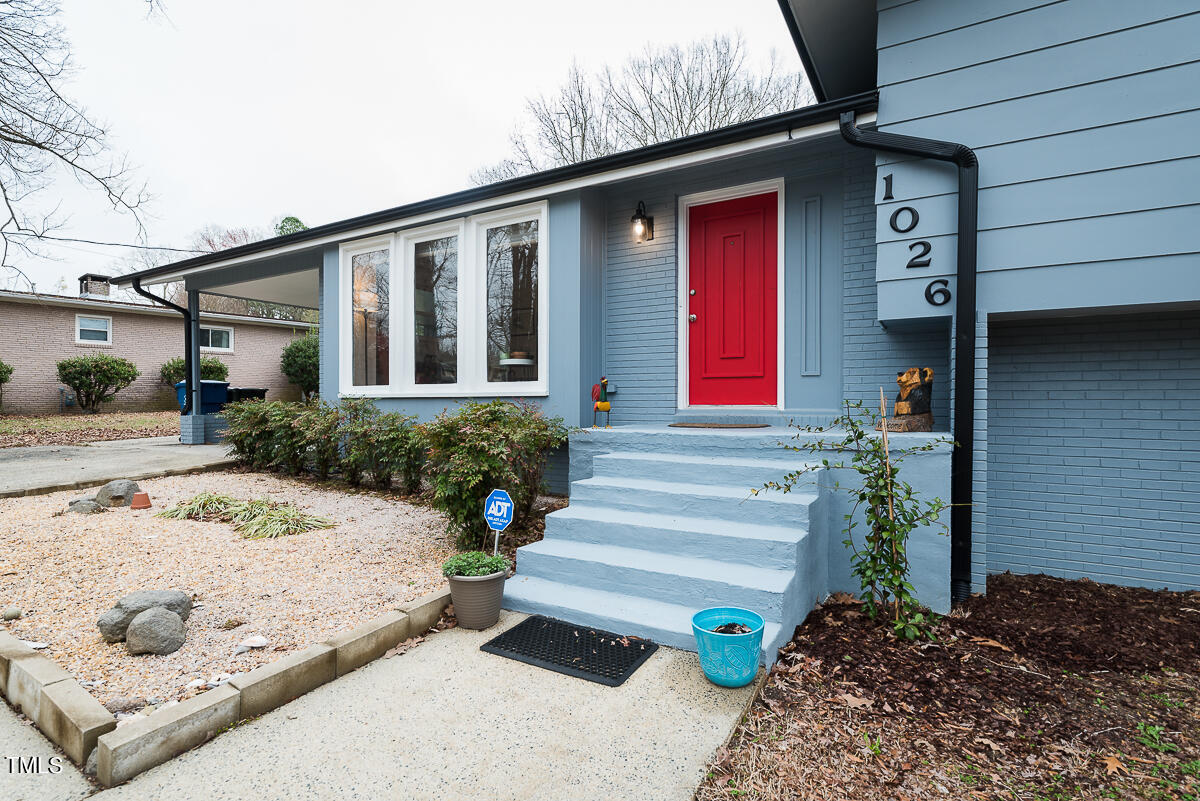 1026 Jerome Road Durham, NC 27713 - Photo 26 of 27 a front view of a house with a yard