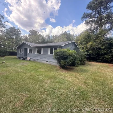 a view of a house with a garden