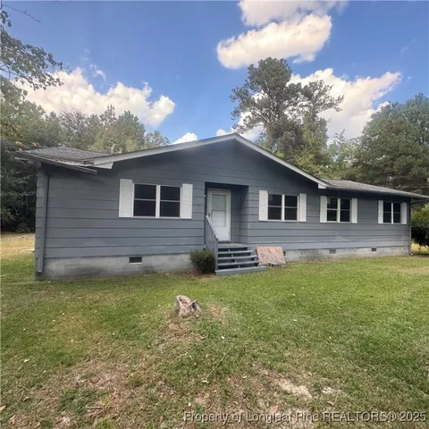 a front view of a house with yard
