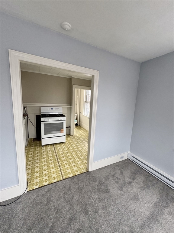 an empty room with a fireplace