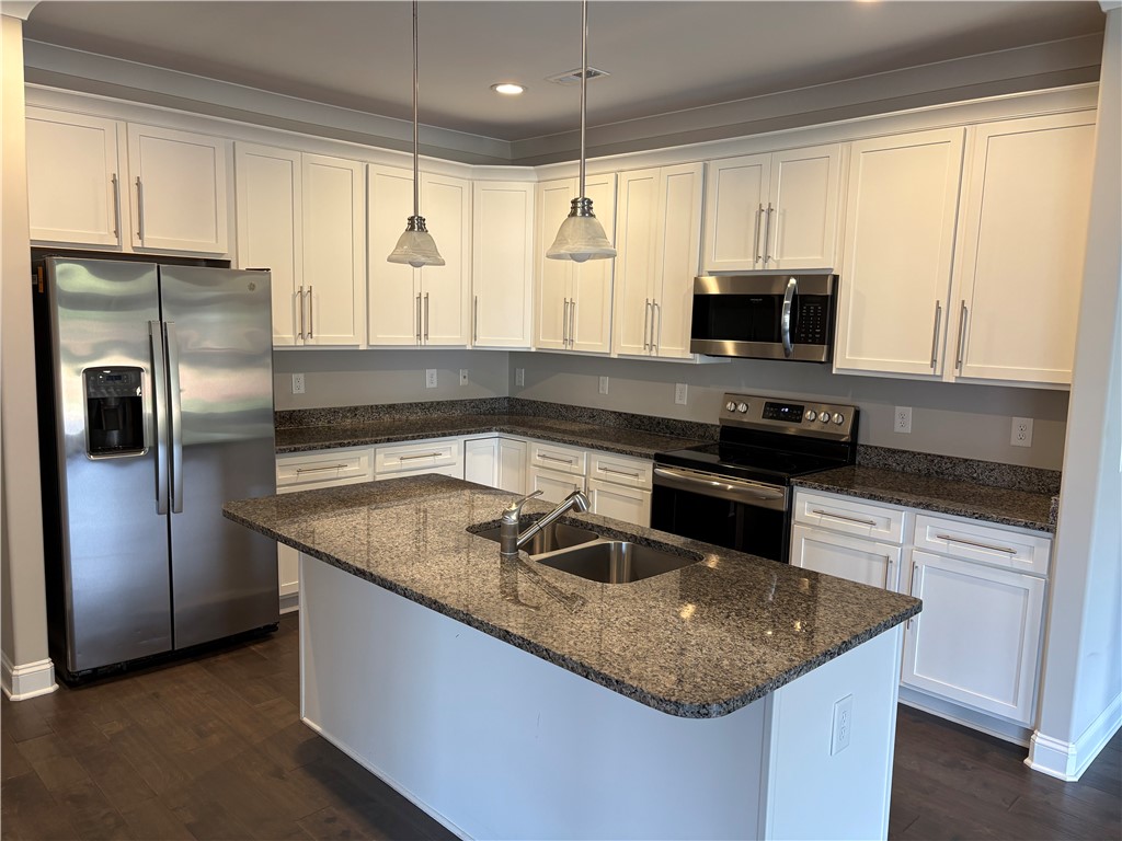 240 Meridian Way Seneca, SC 29672 - Photo 4 of 19 A well-appointed kitchen showcasing an island, granite counters, and stainless steel appliances.