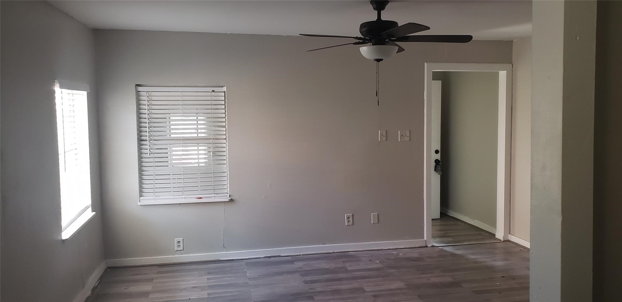912 Jennetta Street Rosenberg, TX 77471 - Photo 4 of 12 a view of a room with a window and wooden floor