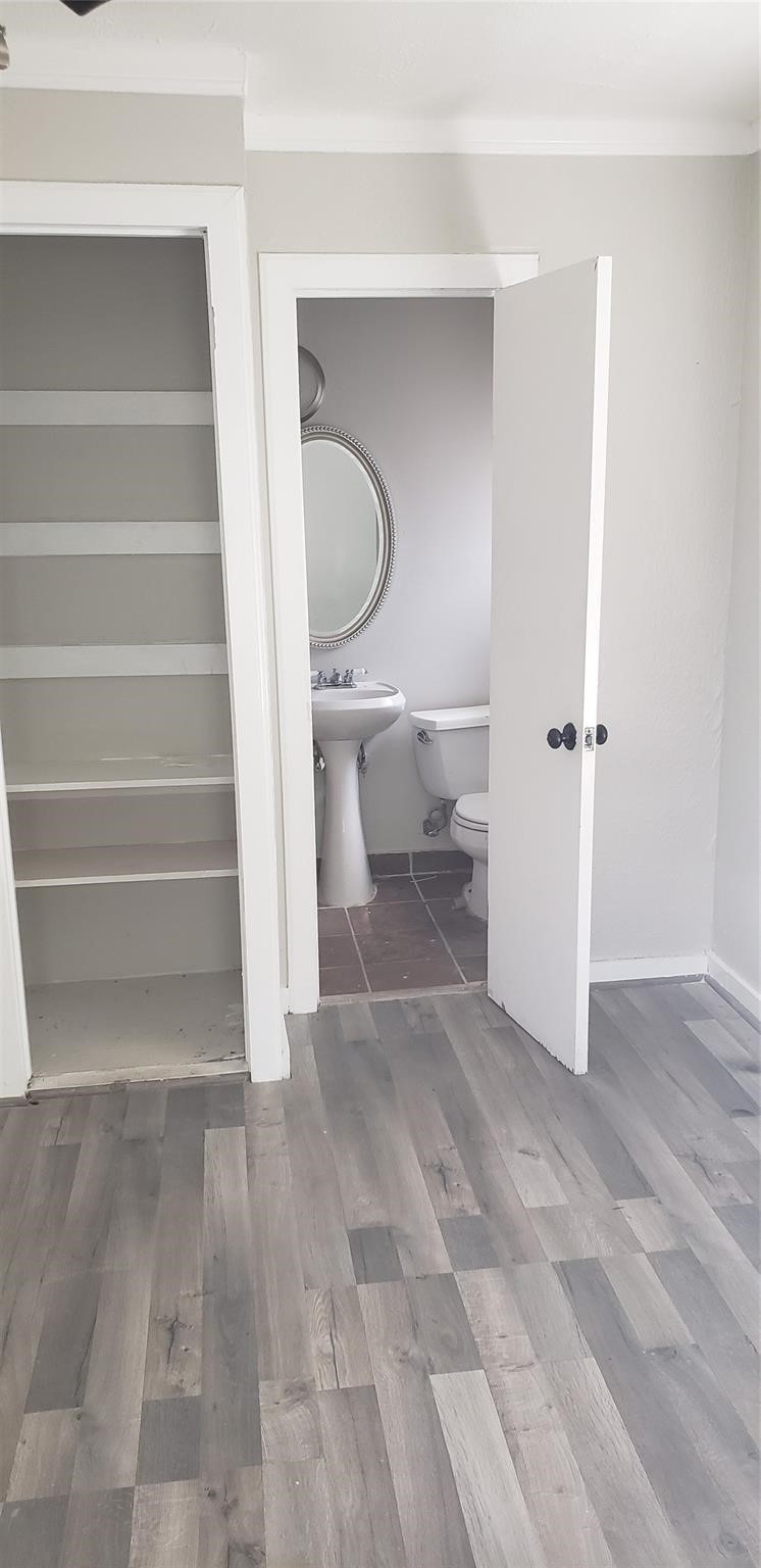 912 Jennetta Street Rosenberg, TX 77471 - Photo 10 of 12 a view of room with stairs and a toilet