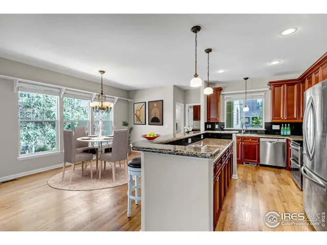 a view of a patio with table and chairs