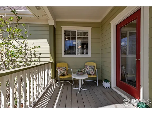 a view of a patio with couches table and chairs and potted plants