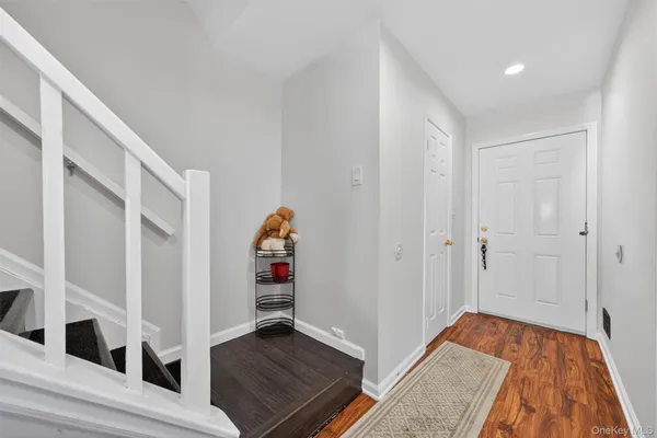 a kitchen with stainless steel appliances granite countertop a sink dishwasher a stove and a microwave oven with cabinets