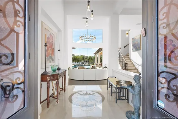 a kitchen with stainless steel appliances granite countertop a sink and a stove