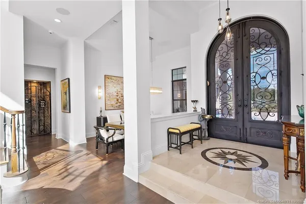a living room with furniture a large window and a flat screen tv