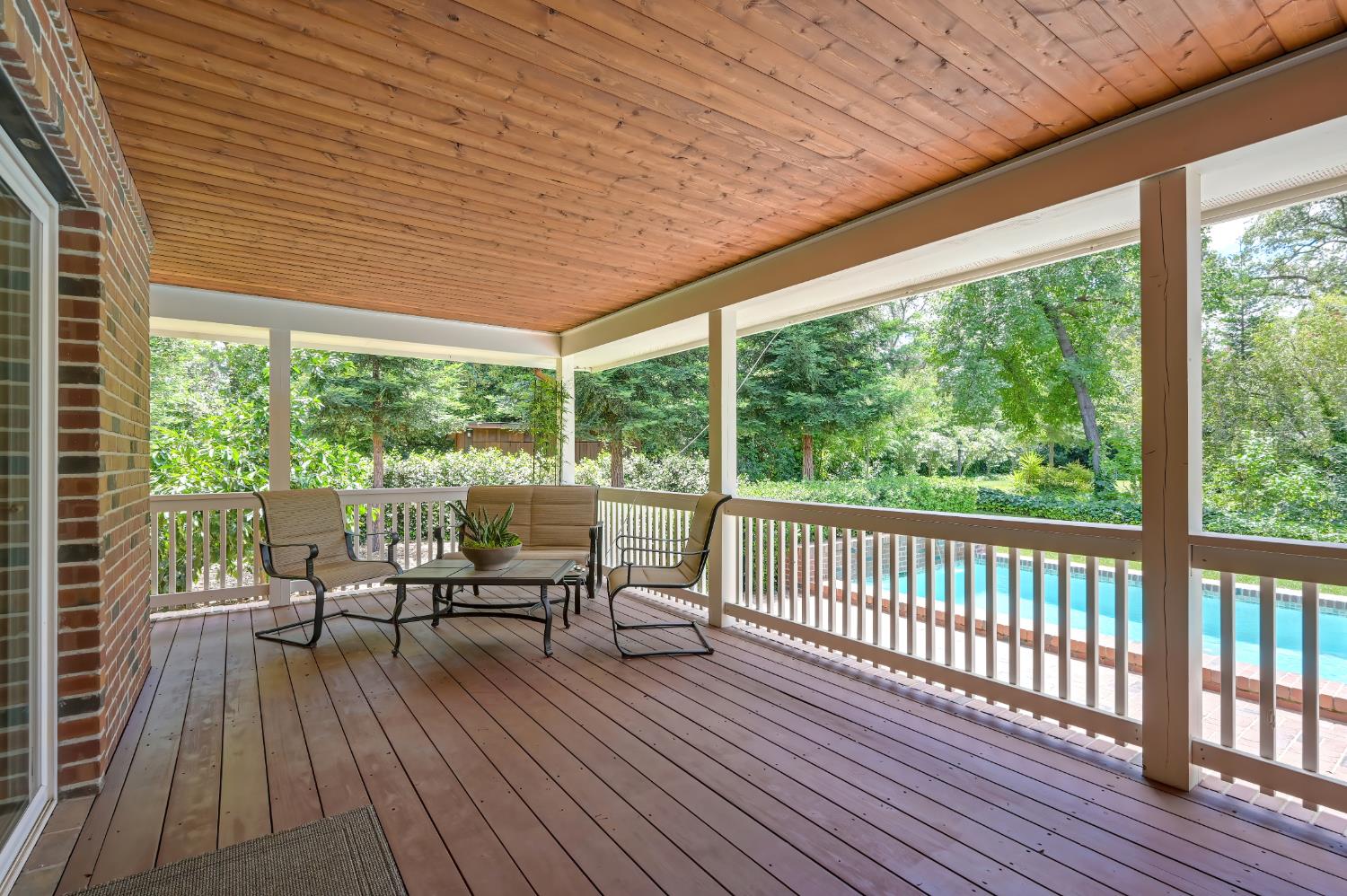3557 Val Verde Road Loomis, CA 95650 - Photo 50 of 71 a balcony with wooden floor outdoor seating and yard in the back