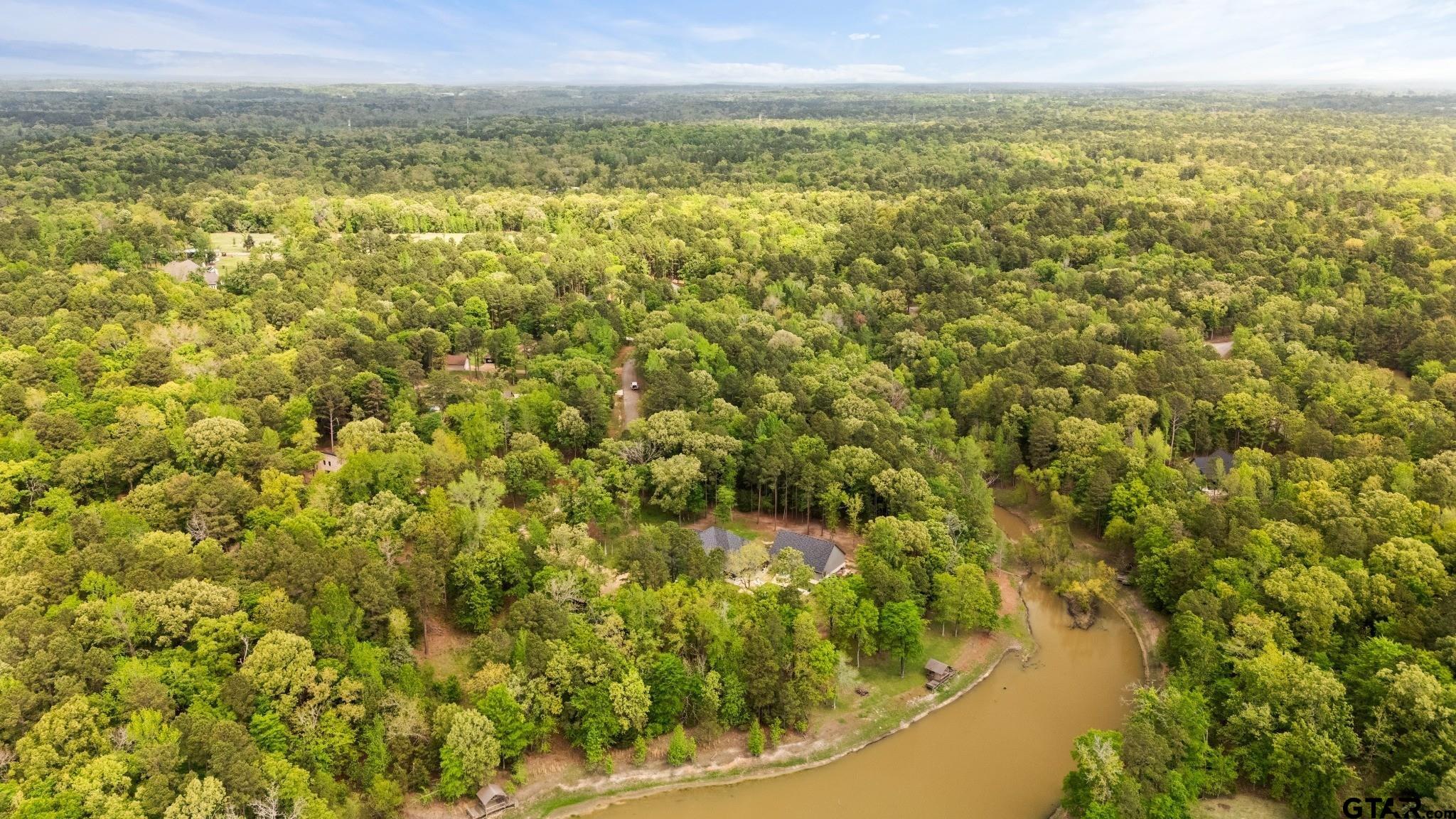 14624 Reserve Court Tyler, TX 75707 - Photo 12 of 12 a view of a lake from a yard