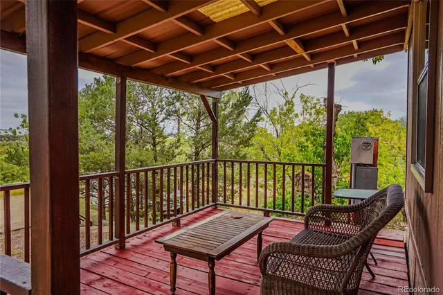 a view of a balcony with furniture