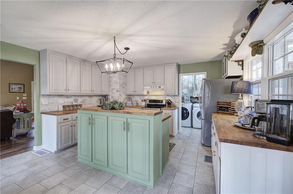 1703 Bryant Road Ranger, GA 30734 - Photo 14 of 71 a kitchen with cabinets and window