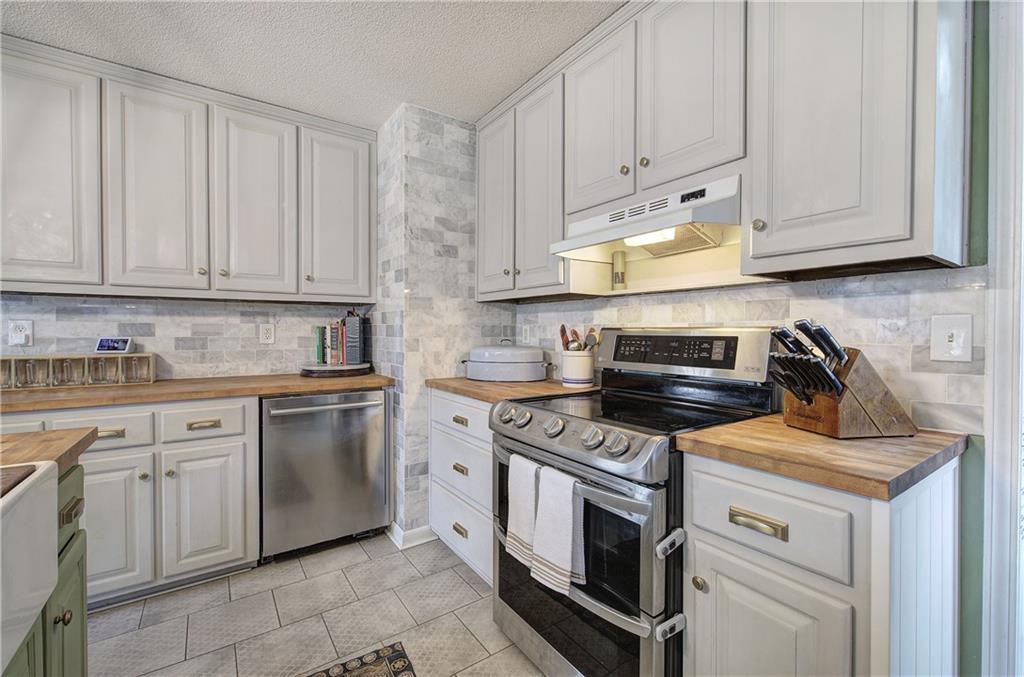1703 Bryant Road Ranger, GA 30734 - Photo 16 of 71 a kitchen with cabinets appliances and a sink
