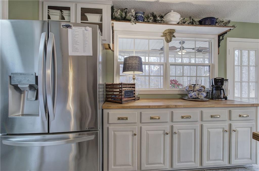1703 Bryant Road Ranger, GA 30734 - Photo 18 of 71 a kitchen with stainless steel appliances granite countertop a refrigerator and a sink