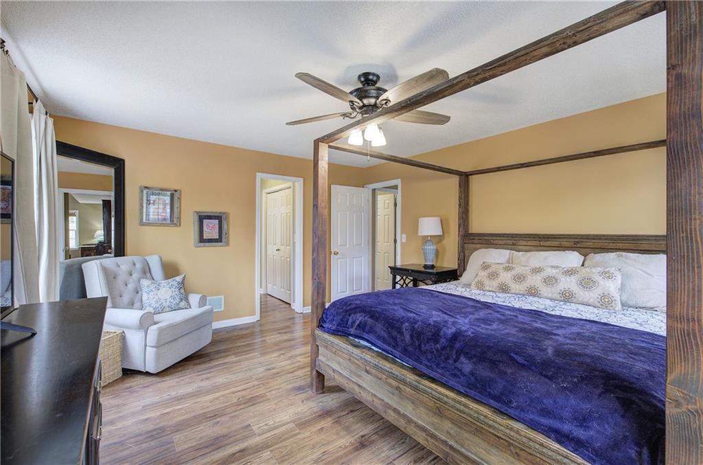 1703 Bryant Road Ranger, GA 30734 - Photo 24 of 71 a bedroom with a large bed and a couch