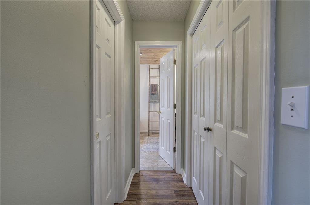 1703 Bryant Road Ranger, GA 30734 - Photo 25 of 71 a view of a hallway with wooden floor and a bathroom