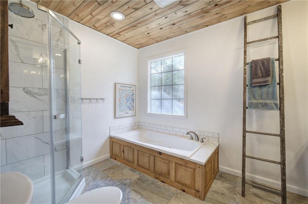 1703 Bryant Road Ranger, GA 30734 - Photo 26 of 71 a bathroom with a tub sink and shower