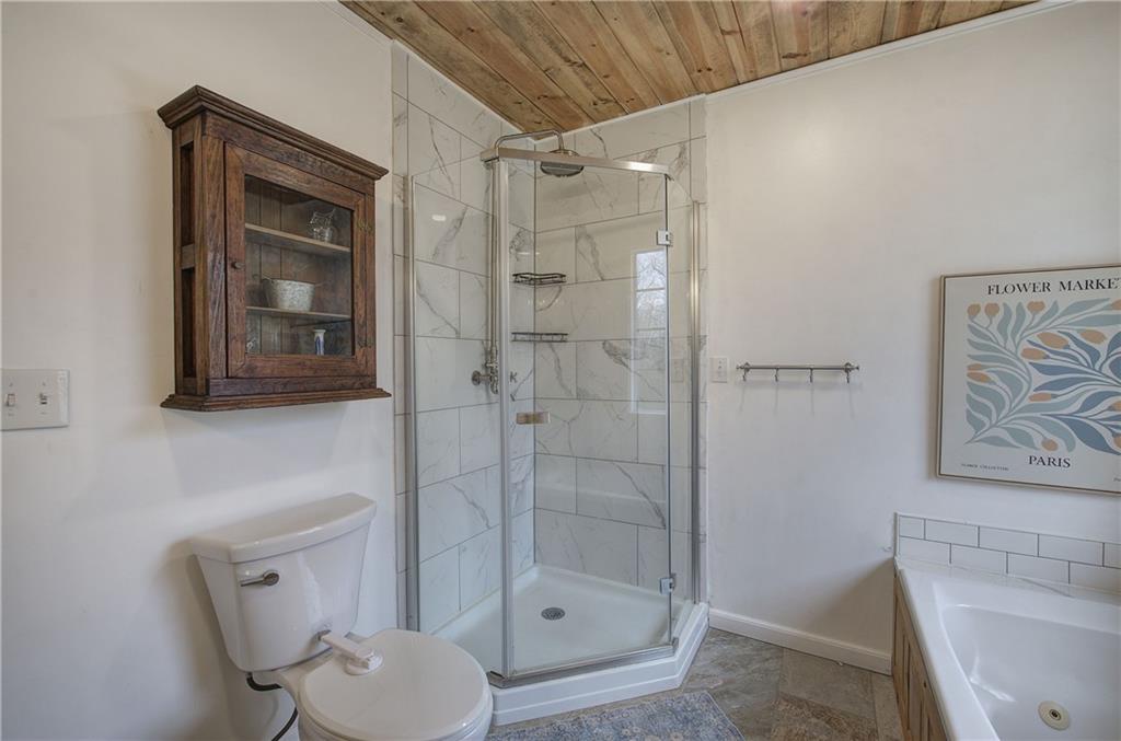 1703 Bryant Road Ranger, GA 30734 - Photo 27 of 71 a bathroom with a toilet and a shower