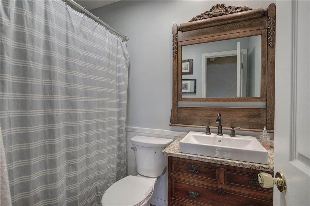 1703 Bryant Road Ranger, GA 30734 - Photo 32 of 71 a bathroom with a sink a toilet and mirror