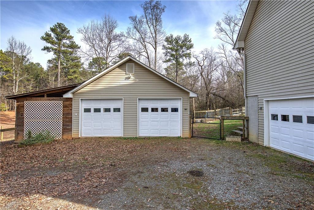 1703 Bryant Road Ranger, GA 30734 - Photo 44 of 71 a view of a house with a yard and garage