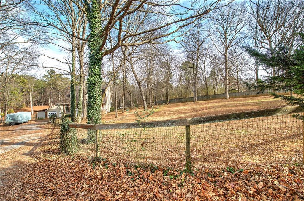 1703 Bryant Road Ranger, GA 30734 - Photo 52 of 71 a backyard of a house with lots of green space