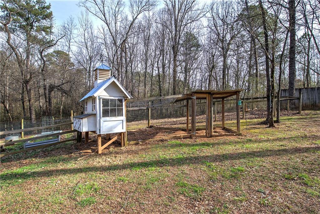 1703 Bryant Road Ranger, GA 30734 - Photo 57 of 71 a front view of a house with a yard table and chairs