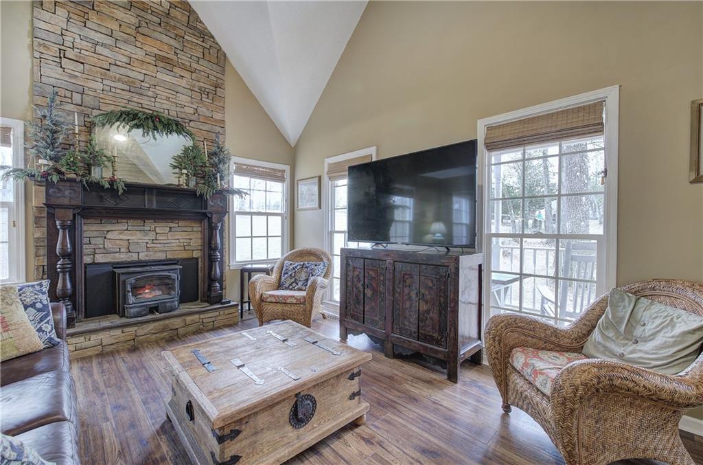 1703 Bryant Road Ranger, GA 30734 - Photo 8 of 71 a living room with furniture a flat screen tv and a fireplace