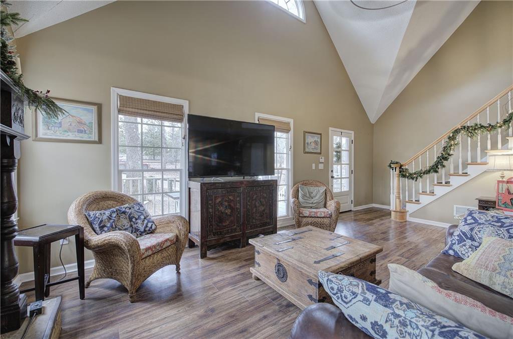 1703 Bryant Road Ranger, GA 30734 - Photo 9 of 71 a living room with furniture a flat screen tv and a fireplace