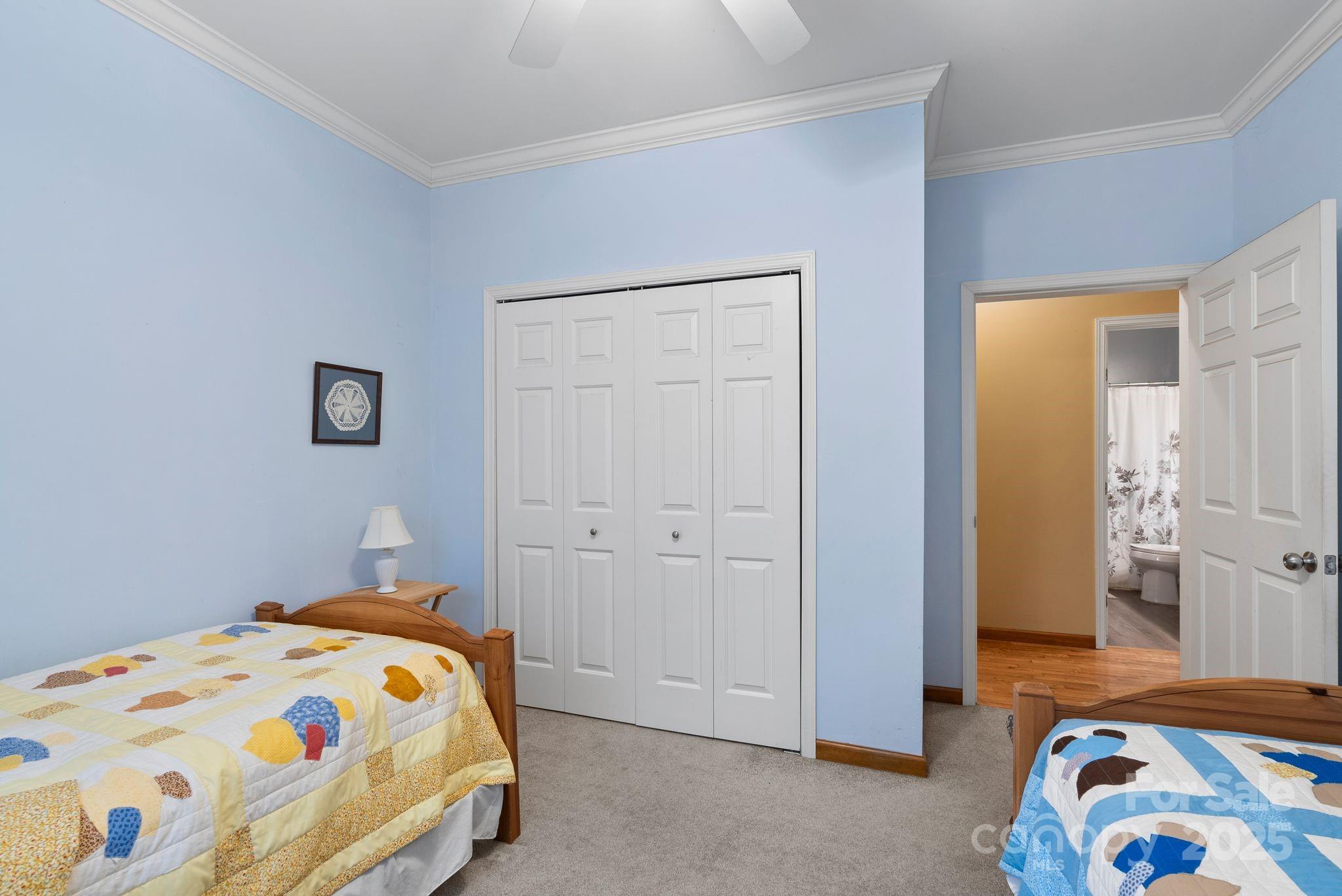 75 Pine Tree Drive Candler, NC 28715 - Photo 15 of 21 a bedroom with a bed and a window