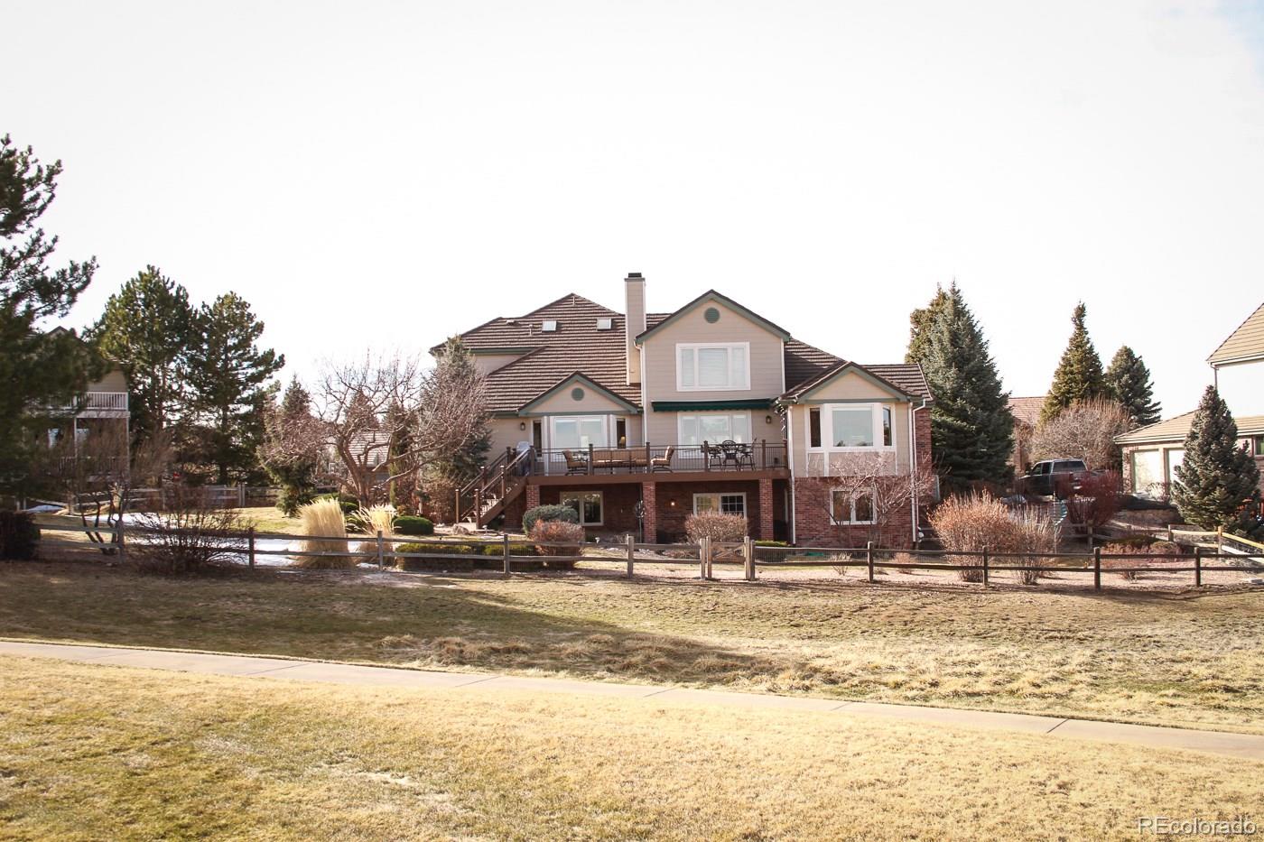 a front view of a building with a yard