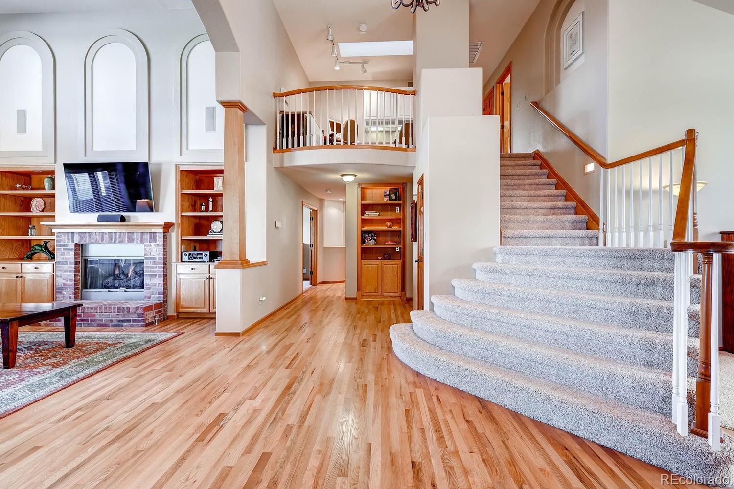 9470 Kemper Drive Lone Tree, CO 80124 - Photo 18 of 35 a view of entryway and hall with wooden floor