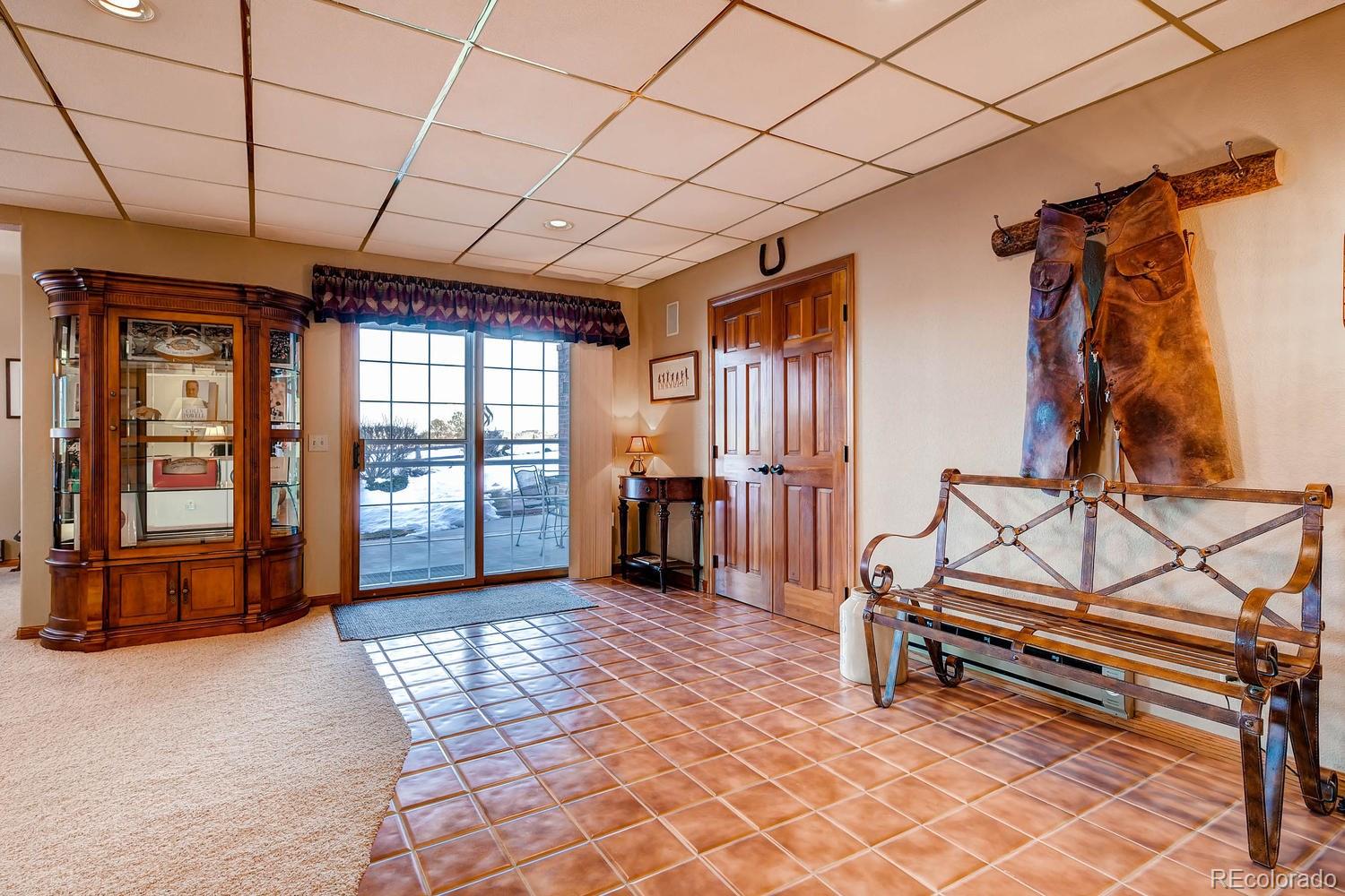 9470 Kemper Drive Lone Tree, CO 80124 - Photo 23 of 35 a room with wooden furniture and next to a window