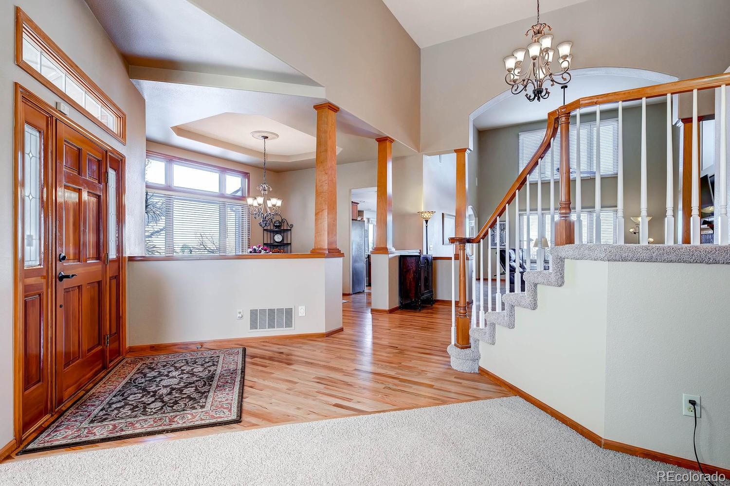 9470 Kemper Drive Lone Tree, CO 80124 - Photo 3 of 35 a view of entryway and hall with wooden floor